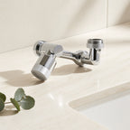 Chrome mechanical-arm faucet extender on a cream studio background