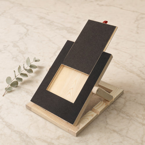 Dog nail scratch board with treat drawer on a cream marble tile — Wombat Haul